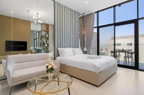 Discovery Gardens Apartment | Studio Al Furjan by STAY IN HOMES - Marina 12min - Self checkin - Metro - Parking