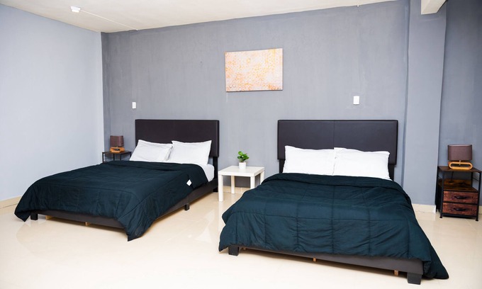 Margibi County Apartment | Studio suite with Two Queen Bed, Sofa and kitchen