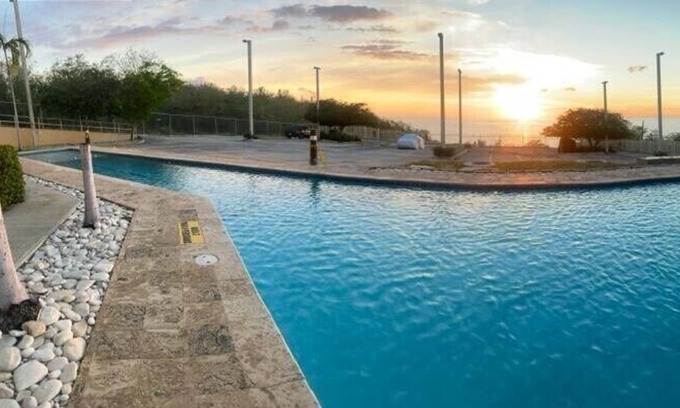 El Combate Condo | Stunning pool and ocean view from your baloney! Wake up to the ocean breeze!