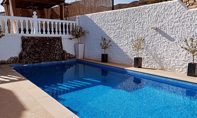 La Parata Villa | Stylish villa with heated pool. 7 minute walk to beach, bars and restaurants!