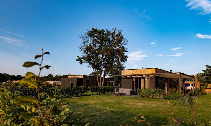 Kotten House | The Amalia is a 4-person holiday home with a cozy and homely living room with an open kitchen, 2 bedrooms, and a spacious outdoor area.