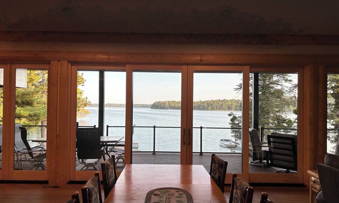 Park Rapids House | The Canopy with a wall of windows overlooking Big Sand Lake.