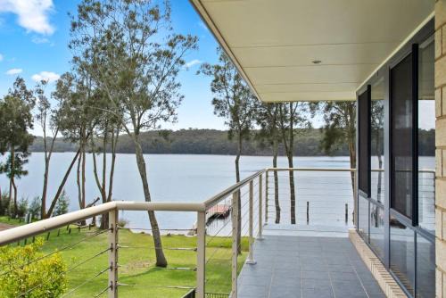 Kings Point House | The Lake House - lakeside retreat w. pool & views