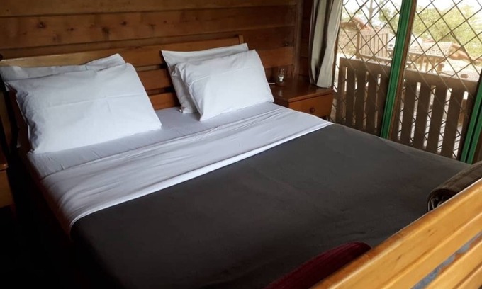 Western Region Ski Chalet | The Observatory Lodge at Kichwamba escarpment overlooking Queen Elizabeth NP.