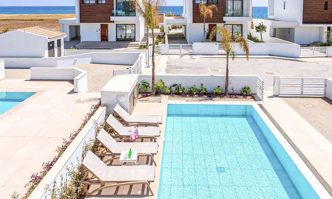 Softades House | This brand-new villa, situated on an exclusive gated development with landscaped gardens, is only mi