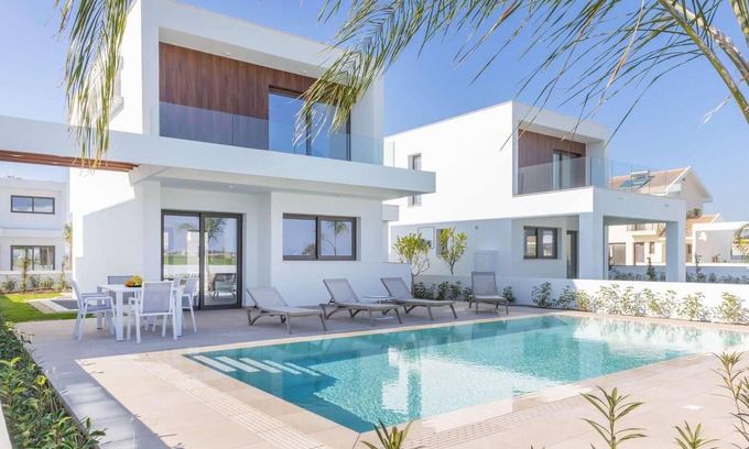 Softades House | This contemporary villa on a gated complex has pretty landscaped gardens and is only a few minutes’
