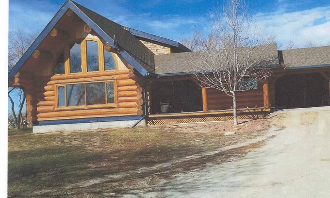Swift Current House | Three level Log Home on Private 40 Acre Estate.