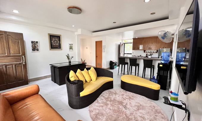 Morong Villa | Triple M Vacation Villas - Yellow house