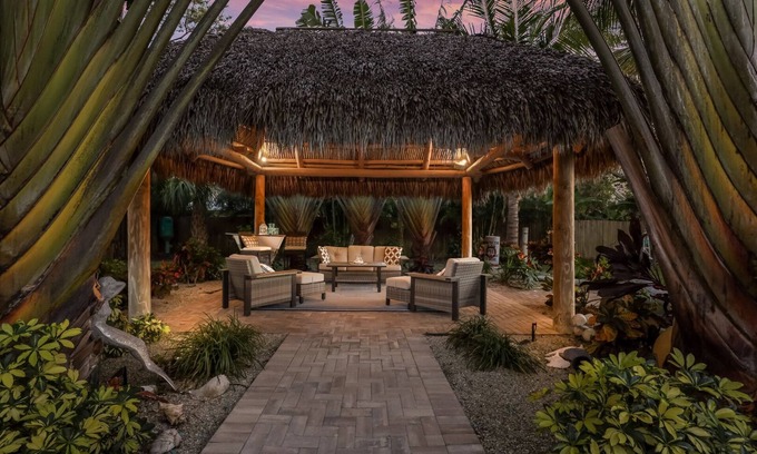 Palma Sola House | Tropical Tiki:Outdoor Oasis, Tiki Hut, Pool by Anna Maria Life Vacation Rentals