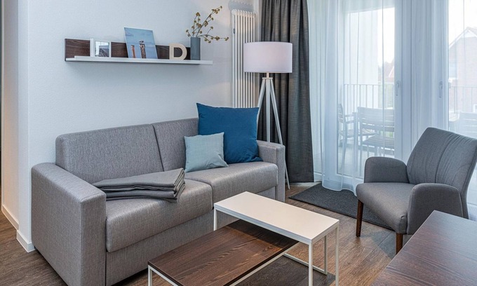 Bensersiel Apartment | Vacation apartment close to the beach with balconies, parking, use of swimming pool & sauna