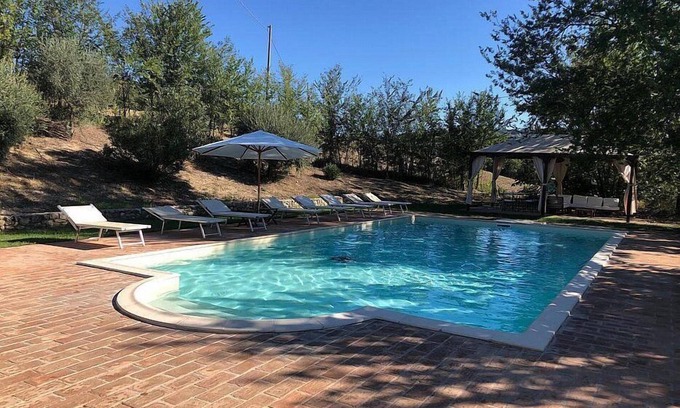 Todi Villa | Villa Gramigna: A charming two-story villa surrounded by the greenery.