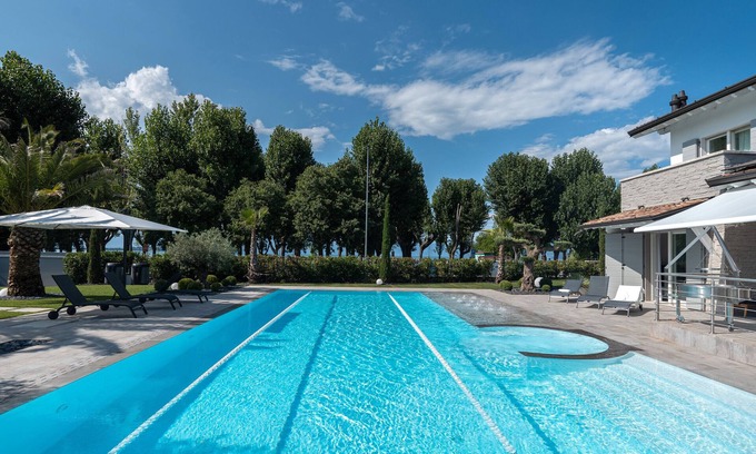 San Benedetto di Lugana Villa | Villa "Sirmione Lakefront" with Lake View, Private Heated Pool and Wi-Fi