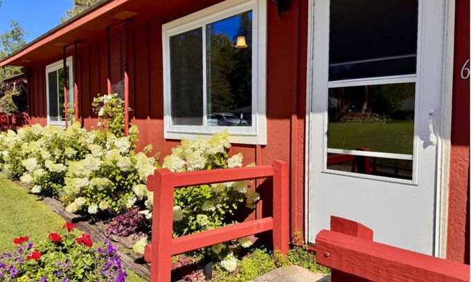 Trout Lake Hotel | Welcoming King Room #6 with AC at lakefront Twin Cedars Resort in Trout Lake MI