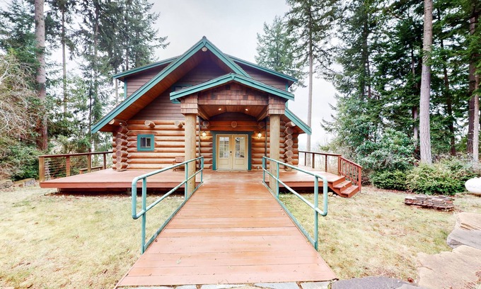 Anderson Island House | Whimsical island stay with Sound view, grill, wrap-around balcony, & game room