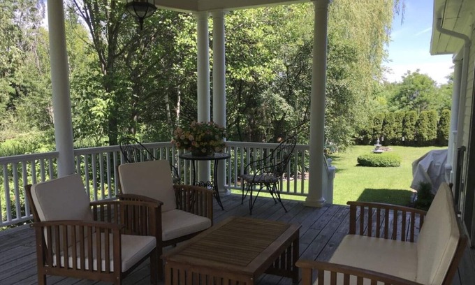 Williston North House | Williston Village INN- Brass room with King size Bed for two people