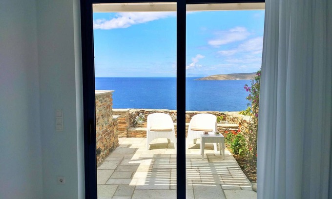 Tinos House | Windmill and houses by the sea // Stavros Bay