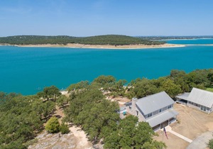 400 feet of private lake front, home and cottage on 3.4 acres, sleeps 16!