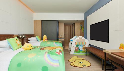 Warmly Cartoon Themed Double Room with Two Double Beds and City View