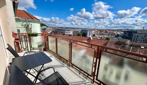 One-Bedroom Apartment with Balcony and City View