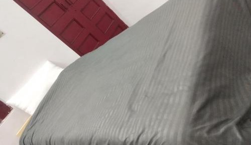 Single Bed in Dormitory Room