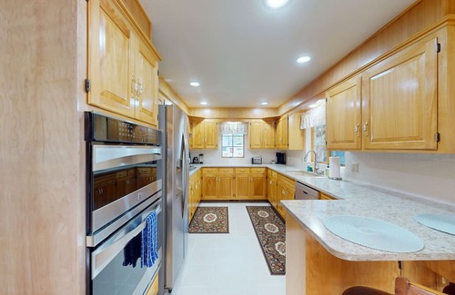 Post Falls House | Beautiful riverfront home with private dock, patio, pool table, WiFi, and W/D
