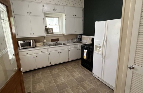 Farmington House | “THE WHITE HOUSE” Step back in time with this Old World charm home.Walk downtown