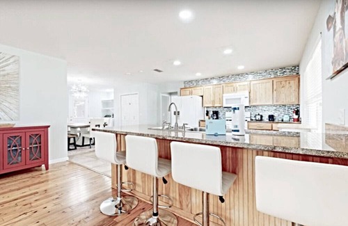 Fort Bay Villa | Green House in Florida w/Trees Surrounding