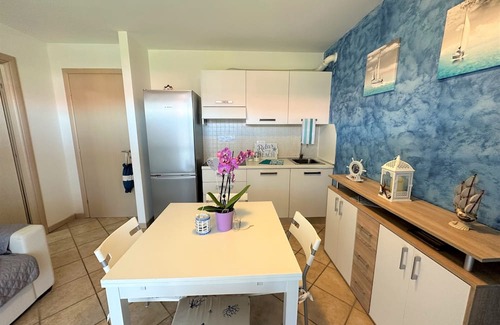 Aprilia Marittima Apartment | Flat in a colourful residence with pool