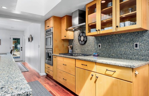 Soquel House | Coastal creekside family-friendly retreat: walkable, pool, spa, campfire