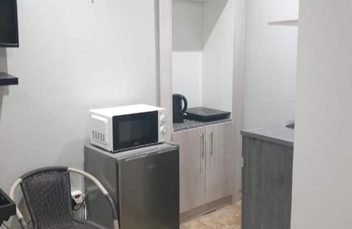 Fichardt Park Apartment | Orchard Guesthouse Double Room with Pool View