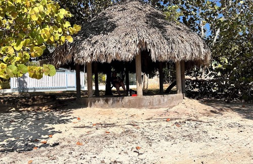 Little Bay Cottage | Fruit Tree Beach Cottage, Bar and Grill with private beach and beautiful sunsets