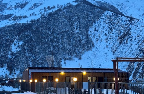 Kazbegi Apartment | A studio apartment at a secluded area by the river, surrounded by mountains.