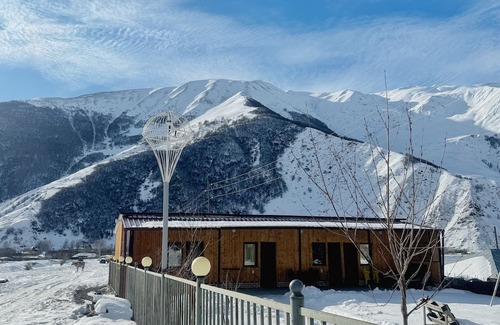 Kazbegi Apartment | A studio apartment at a secluded area by the river, surrounded by mountains.