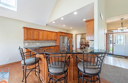 Carter Lake House | 5 bed 3 miles to downtown Omaha and CWS. Hot Tub, Pool Table & Dart Board