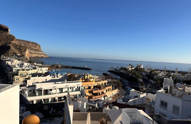 A tastefully designed apartment with a private balcony overlooking the harbour.