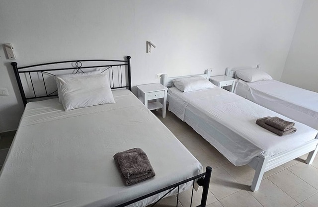 Room 'Economy Quadruple 1' with Balcony and Air Conditioning