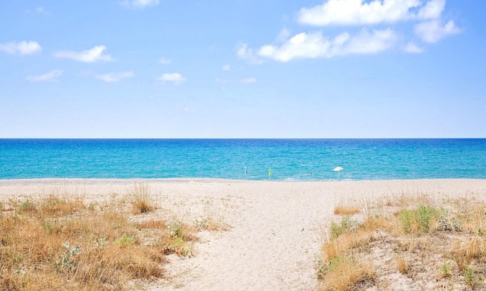 Mattinata Apartment | Enjoy a magnificent view of the sea from this vacation apartment.