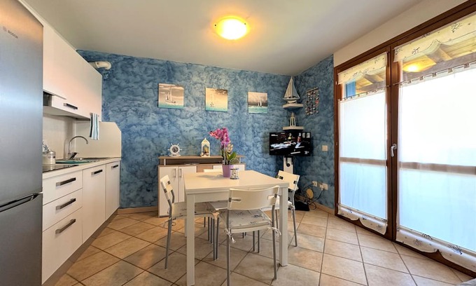 Aprilia Marittima Apartment | Flat in a colourful residence with pool