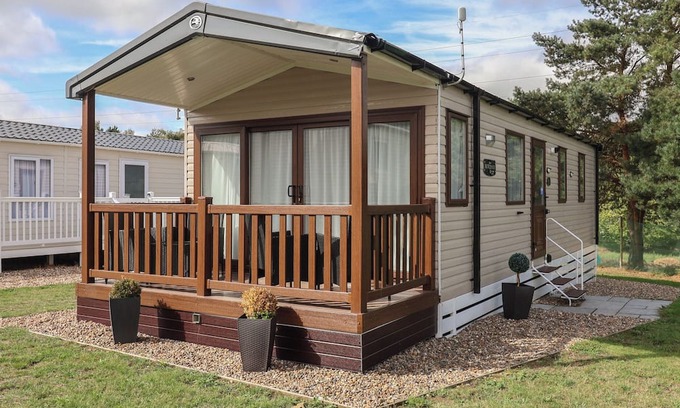 Hopton Cottage | STAG LODGE, CARAVAN 70, with pool in Belton, Norfolk