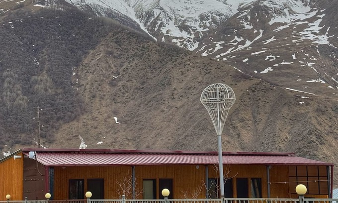 Kazbegi Apartment | A studio apartment at a secluded area by the river, surrounded by mountains.